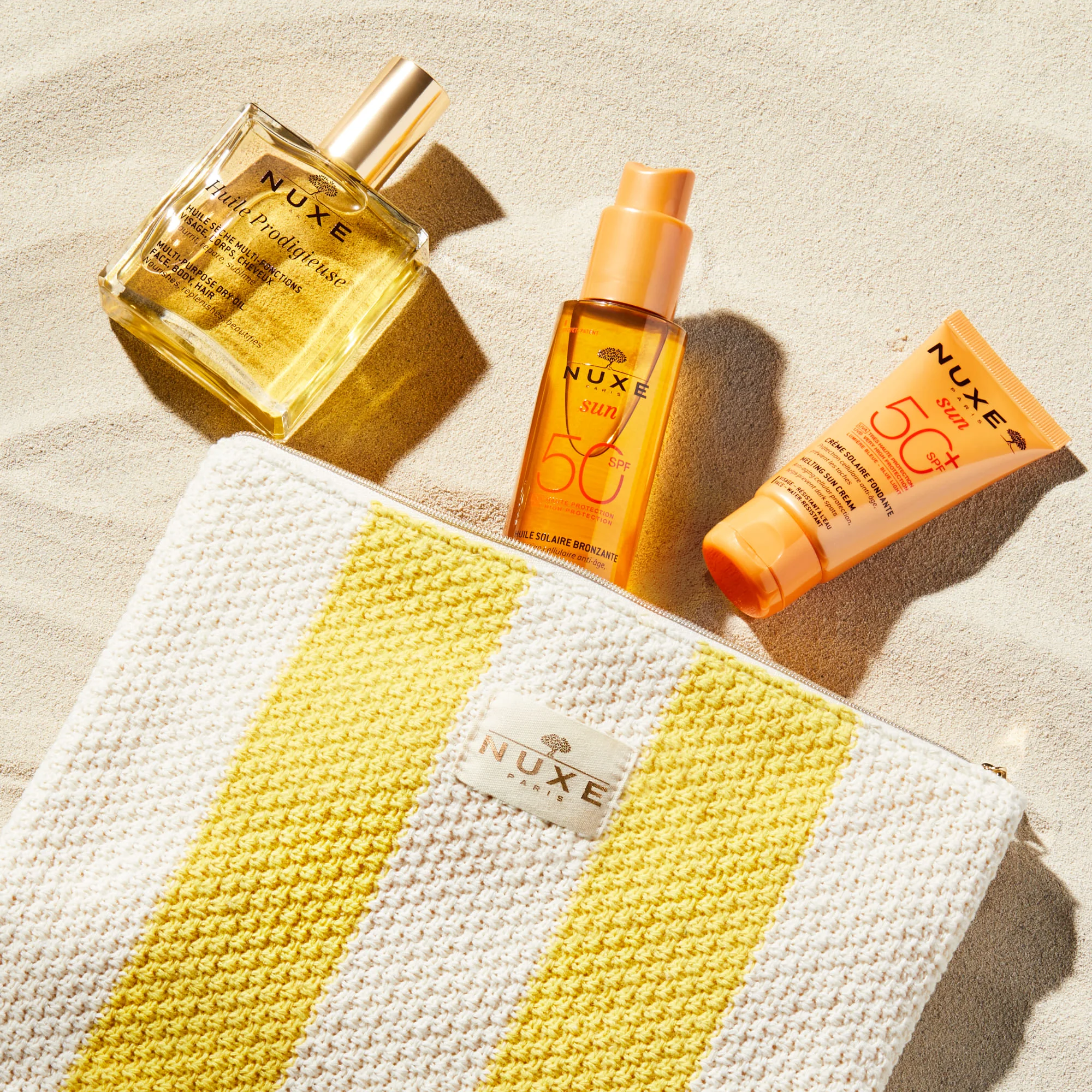 Nuxe Summer Essentials Pochette Crema Solare Viso SPF50+ 50ml + Huile 50ml + Olio Abbronzante SPF50 150ml